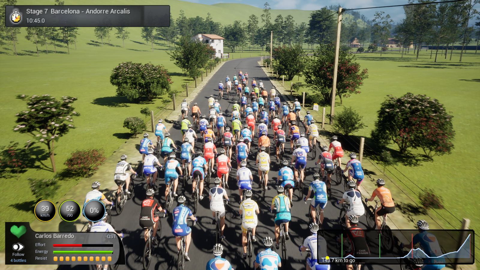 Tour de France Unreal development capture of the peloton passing countryside and farm buildings on stage 7